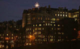 Edinburgh, Christmas 2005  - The City Chambers and Christmas Star in the High Street  -  view from East Princes Street Gardens 
