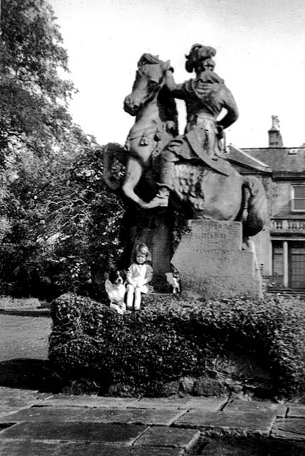 Morag Stewart  (sister of Alan Stewart) and dog, Lassie, sitting on the statue in front of Clermiston House, in the early-1960s