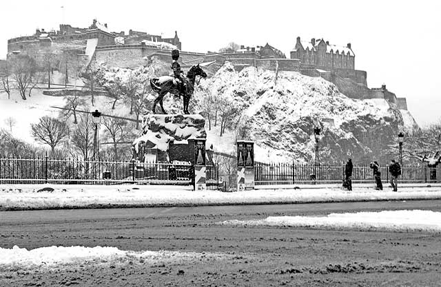 Looking to the south across Princes Street  -  Royal Scots Greys Statue and Edinburgh Castle