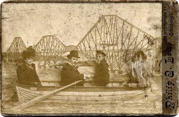 Cabinet Print by Philip E Low, of a group in a studio boat in front of a backdrop of the Forth Bridge