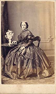 G W Fisher  -  Carte de visite  -  Lady and vase of flowers
