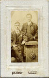 GR Mackay  -  Small photograph of two men  -  mounted on carte de visite size card