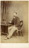 A carte de visite by the Edinburgh professional photographer John Ross   -  from his studio at 36 Hanover Street  -  man on a chair
