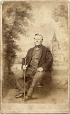 Stewart & Oman  -  Carte de Visite of a man with a stick, seated