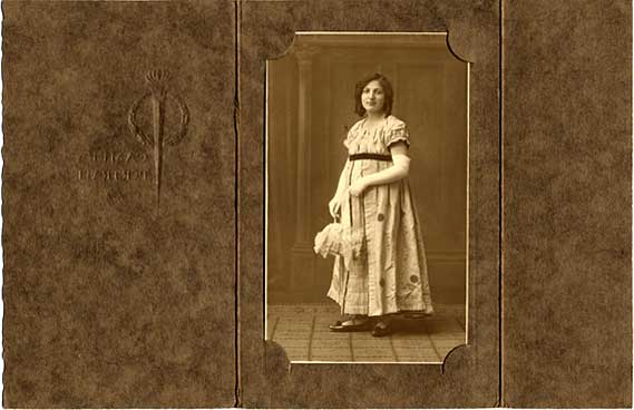 Folder containing a postcard portrait of a lady  -  from the studio of Drummond Shiels  -  folder open