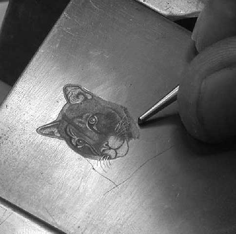 An engraving tool in use