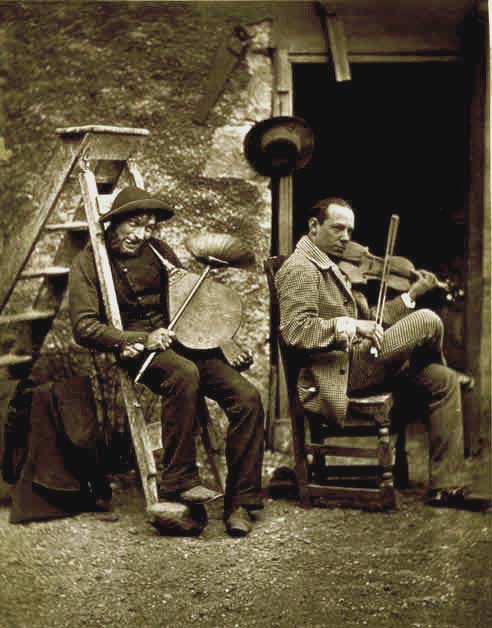 Thomas Rodger [sen.] - Playing the bellows" seated beside the Hungarian violinist, Edouard Remeny.