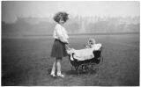Jerome Photo  -  Pat Woolley with doll's pram in the Meadows, around 1938-39