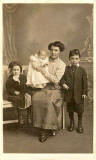 Postcard by Morrisons  -  Family possibly wearing Edwardian clothing
