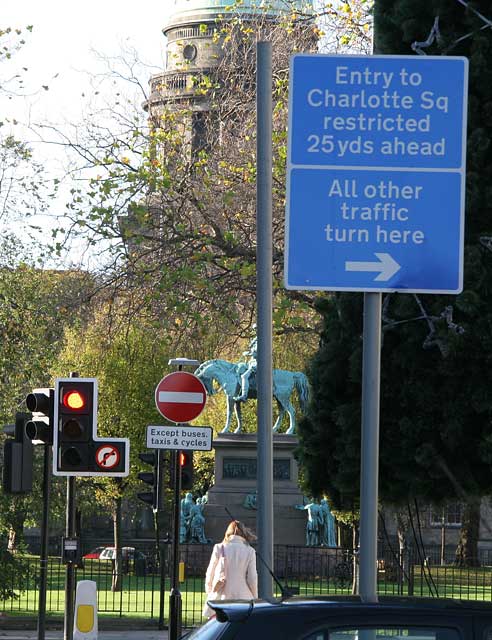 Road sign introduced into Edinburgh New Town in 2005 as part of the Central Edinburgh Traffic Management Scheme  -  George Street  -  Looking west towards Charlotte Square