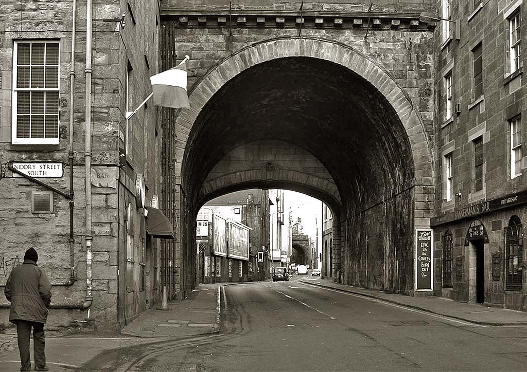 Looking to the west along Cowgate, and through one of the arches of South Bridge, towards the Grassmarket, 2004