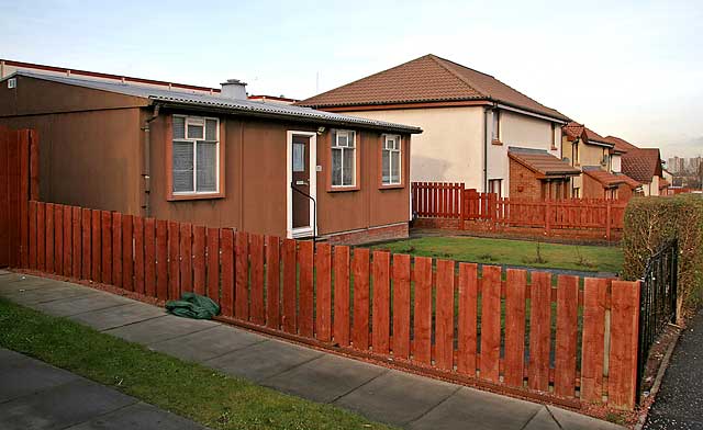 Looking south up Craigour Avenue, including one of the prefab bungalows that has survived in the area