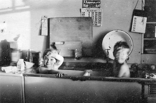 Bathtime:  Leanna Weeks  + John Morton at their prefab, 5 Craigour Avenue  -  Photo taken August 1950