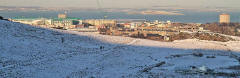Looking north from Hunter's Bog in Holyrood Park to Hibs Stadium and the island of Inchkeith