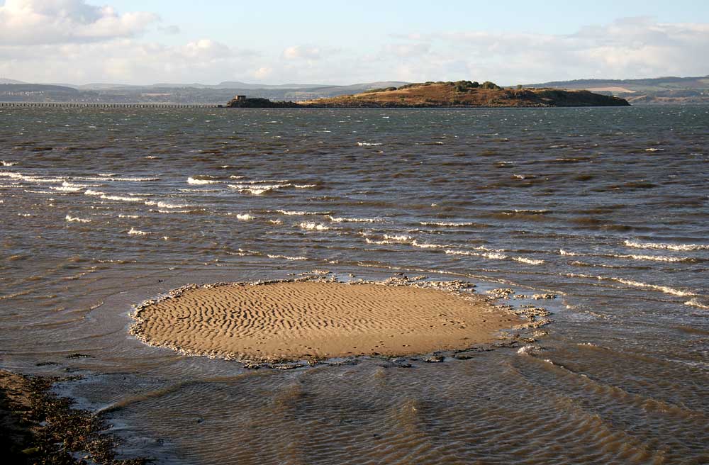 Cramond Island and san at Silverknowes about to be covered by the incoming tide
