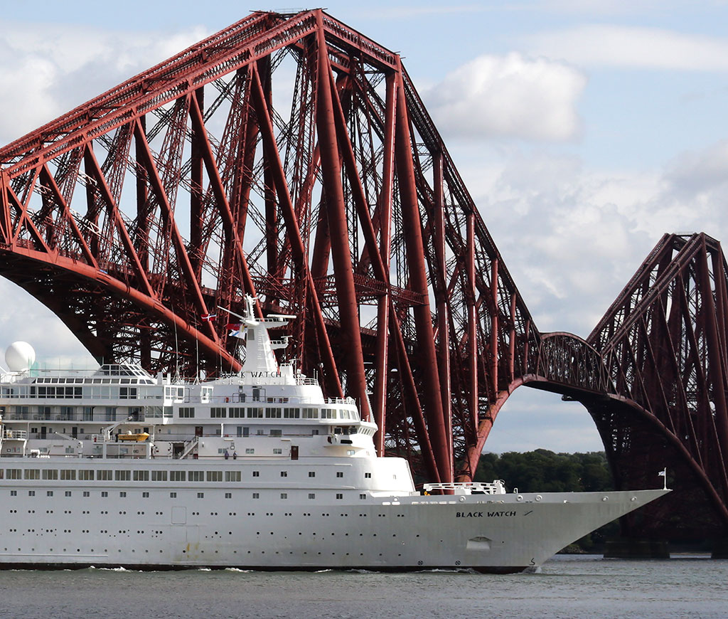 Zoom in on a photo of Crruise Liner, 'Black Watch' passing under the Forth Bridge on her way to dock at Rosyth
