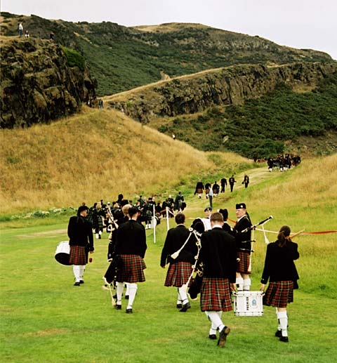 Pipers make their way up the hill to Hunter's Bog in Queen's Park before taking part in the "Beating the Retreat" ceremony  -  17 August 2003