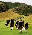 Pipers make their way up the lower slopes of Arthur's Seat towards Hunter's Bog in praparation fot the "Beating the Retreat" ceremony  -  17 August 2003