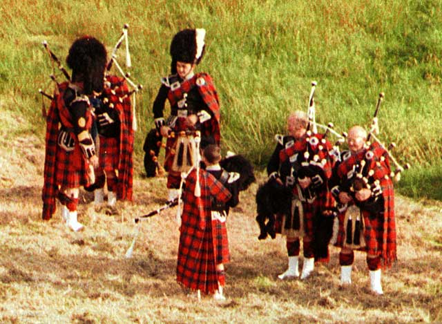 Pipers gather in Hunter's Bog on Arthur's Seat in Queen's Park, Edinburgh, preparing to take part in the ceremony of "Beating the Retreat" on 17 August 2003