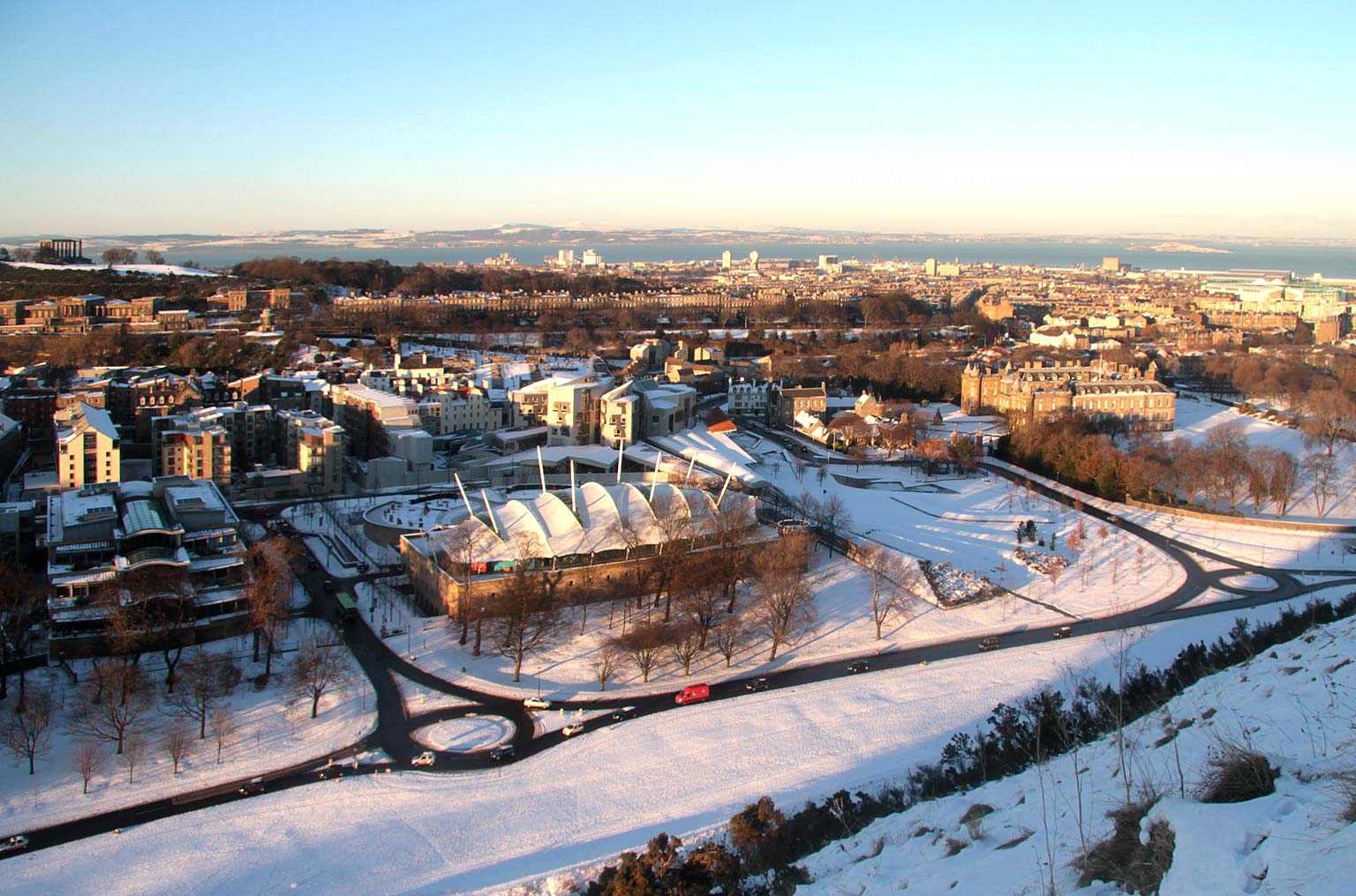 Looking North from The Radical Road in Holyrood Park to Dynamic Earth, The Scottish Parliament and The Palace of Holyrood