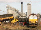 A freight train of empty coal wagons reverses into Leith Docks to piick up imported coal for delivery to power stations
