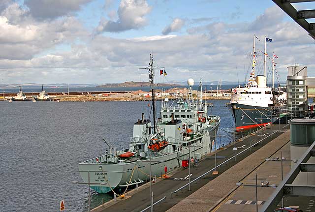 Tugs, Sulisker (Scottish Fisheries Protection Vessel) and Royal Yacht Britannia at Leith Western Harbour  -  September 2005