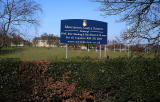 Merchiston Castle School  -  School sign, with school and grounds in the background