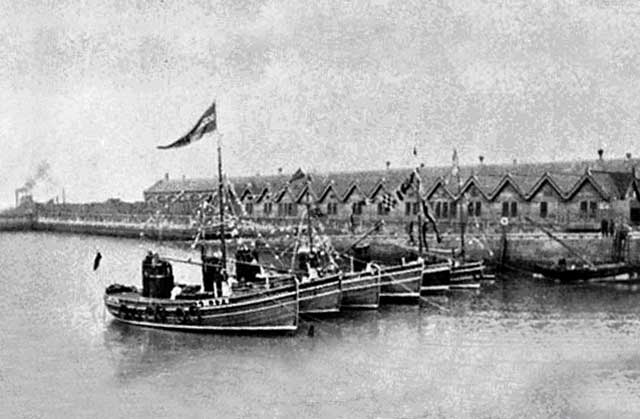 Newhaven Harbour, 1937 - with a dredger working on the extension to Leith Western Docks in the background
