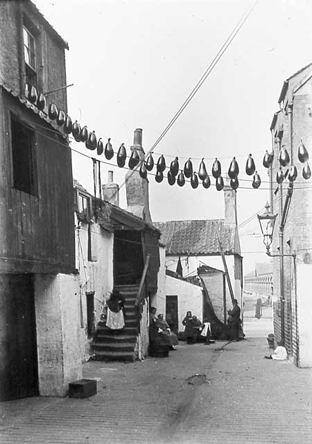 Newhaven Streets  -  Wester Close with sheeps bladders hanging on lines  -  1880s