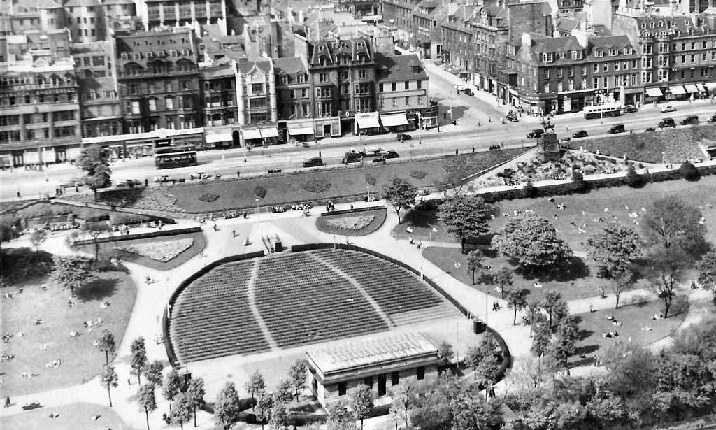 looking down on Princes Street and the Ross Bandstand in Princes Street Gardens from Edinburgh Castle  -  1950s