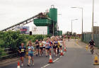 Edinburgh Waterfront  -  The 2003 Edinburgh Marathon passes Hanson's precast concrete works in West Shore Road  -  15 June 2003