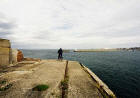 Edinburgh Waterfront  -  A cyclist reaches the end of Western Breakwater, Granton Harbour  -  14 September 2003