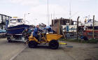 Edinburgh Waterfront  -  A dumper truck takes a boat from Middle Pier into the Royal Forth Yacht Club boatyard  -  7 April 2004