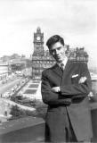 Frank Ferrri standing on the Scott Monument with the North British Hotel in the background