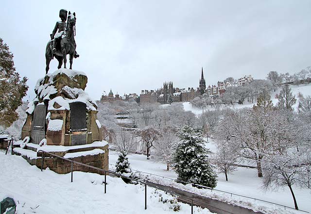 Royal Scots Greys Statue in West Princes Street Gardens  -  Edinburgh Old Town in the background