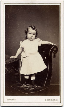 A carte de visite by the Edinburgh professional photographer Thomas H Douglas  -  small girl on a chair