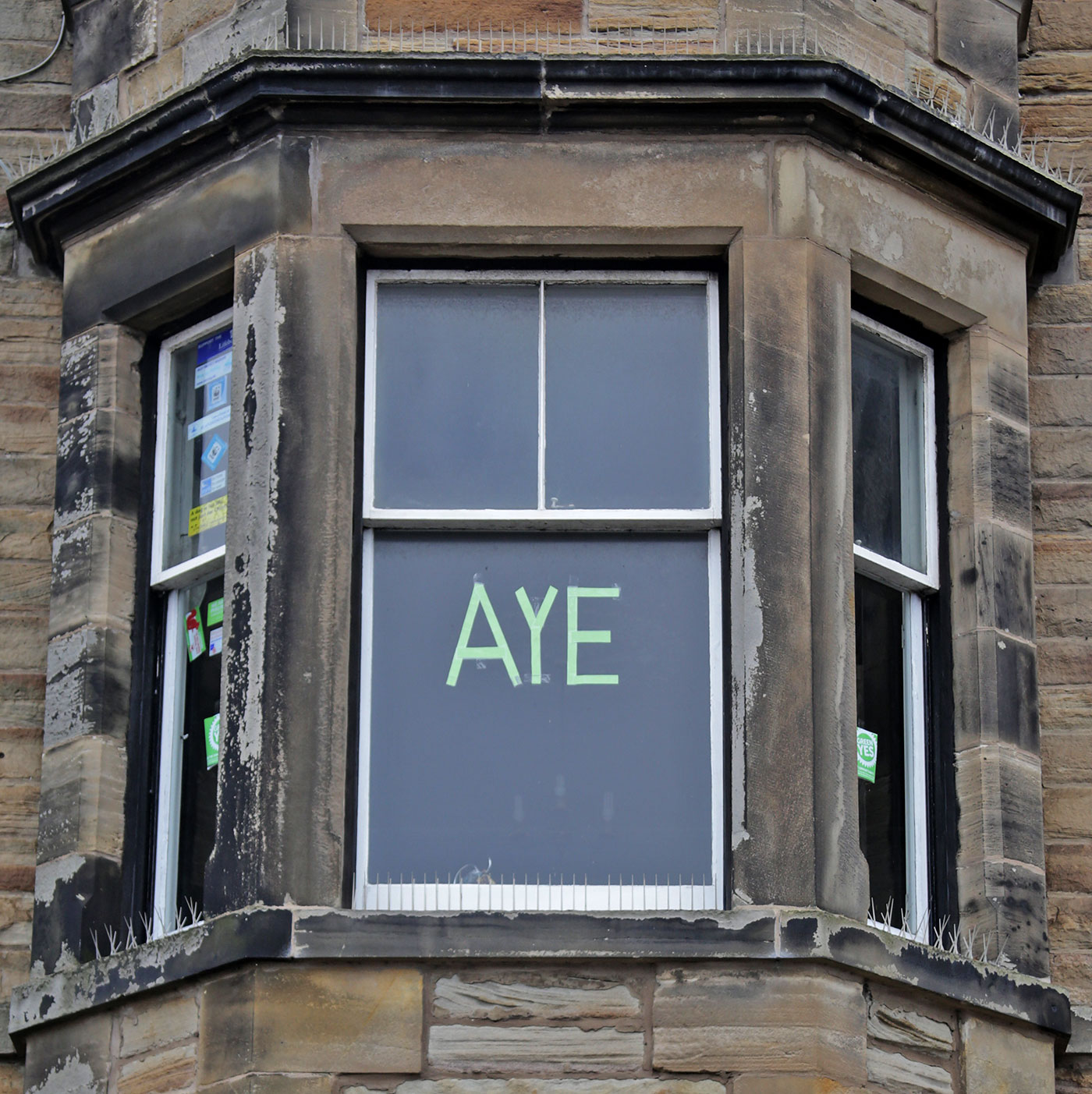 Photos taken in Edinburgh on the two days leading up to the Scottish Referendum Vote on 18 September 2014  -  'Aye' on a window in the Tenements at Starbank Road, Newhaven