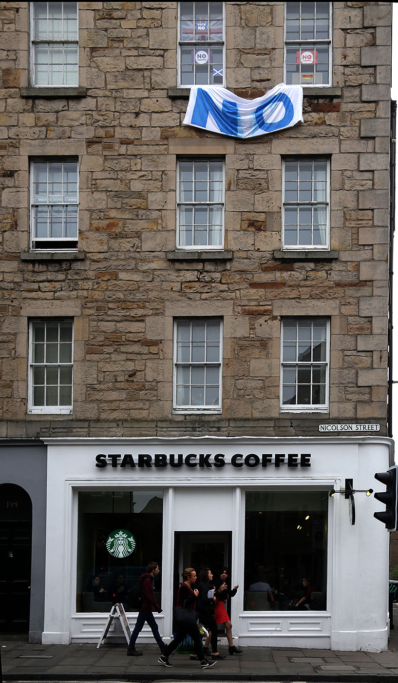 Photos taken in Edinburgh on the two days leading up to the Scottish Referendum Vote on 18 September 2014  -  'No' Banner and 'No' Posters on Tenement above Starbucks on the corner of Nicolson Street and East Crosscauseway, South Side