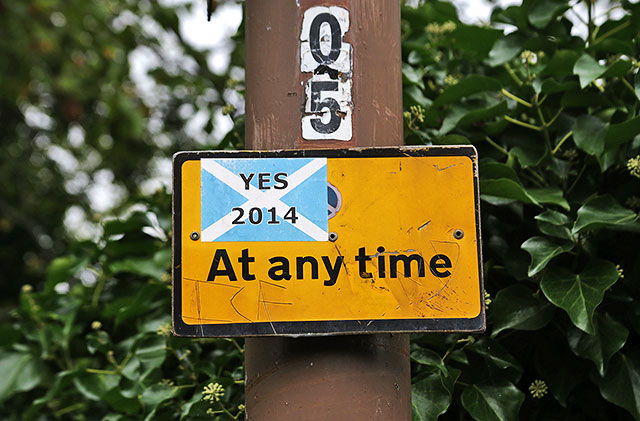 Photos taken in Edinburgh on the two days leading up to the Scottish Referendum Vote on 18 September 2014  -  'Yes 2014' sticker on a 'No Waiting' sign at Gilmerton Road, Newington.