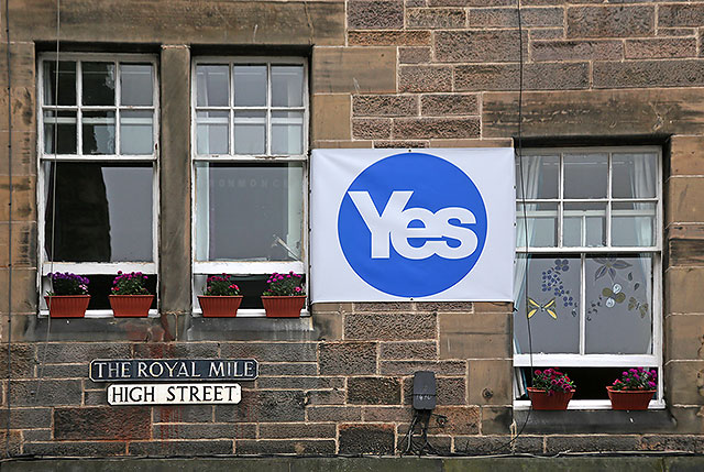 Photos taken in Edinburgh on voting day in the  Scottish Indepemdence Referendum on 18 September 2014  -  The Royal Mile  -  A 'Yes' message on tenements in the High Street