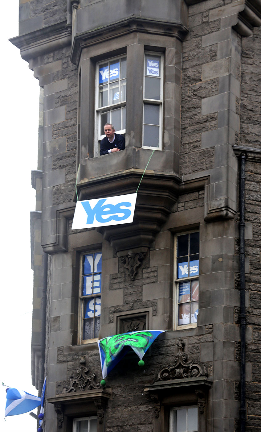 Photos taken in Edinburgh on voting day in the  Scottish Indepemdence Referendum on 18 September 2014  -  The Royal Mile  -   'Yes' messages on tenements near the junction of St Mary's Street and the royal Mile