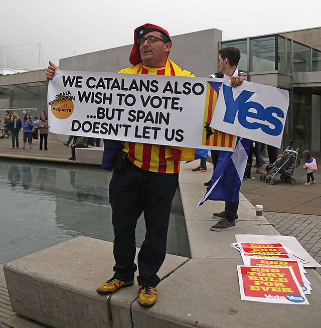 Photos taken in Edinburgh on voting day in the  Scottish Indepemdence Referendum on 18 September 2014  -  Outside the Scottish Parliament  -  A supporter of Independence for the Catalans