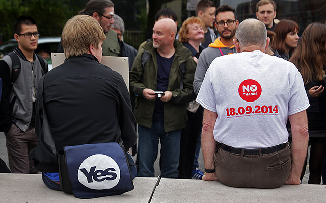 Photos taken in Edinburgh on voting day in the  Scottish Indepemdence Referendum on 18 September 2014  -  Outside the Scottish Parliament  -  'Yes' and 'No' supporters