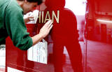 Applying the transfers to Lothian Bus No 522 at Seafield Paintshop