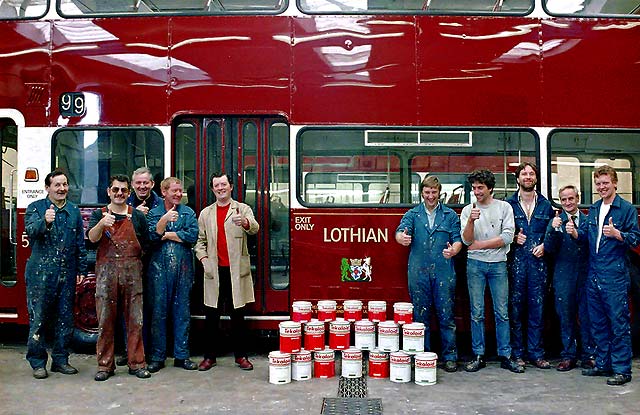 Painters standing in front of Newly Painted Lothian Bus No.522