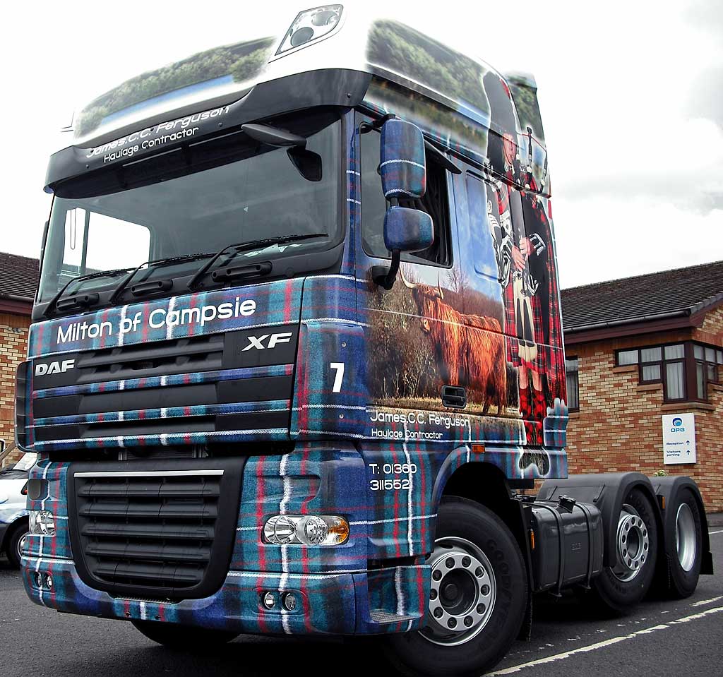 Truck decorated with photos, including my photograph of highland cow
