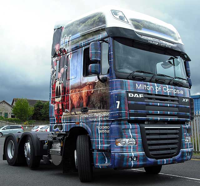 Truck decorated with photos, including my photograph of highland cow