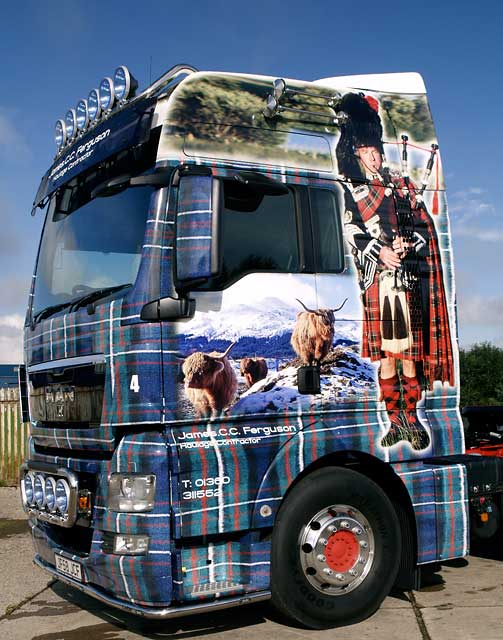 Truck decorated with photos, including my photograph of highland cattle in the snow.
