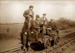 Six railway workers on a trolley  -  Photograph probably taken in the 1950s