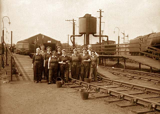 Ten railway cleaners and three buckets  - This photograph was probably taken in the 1950s